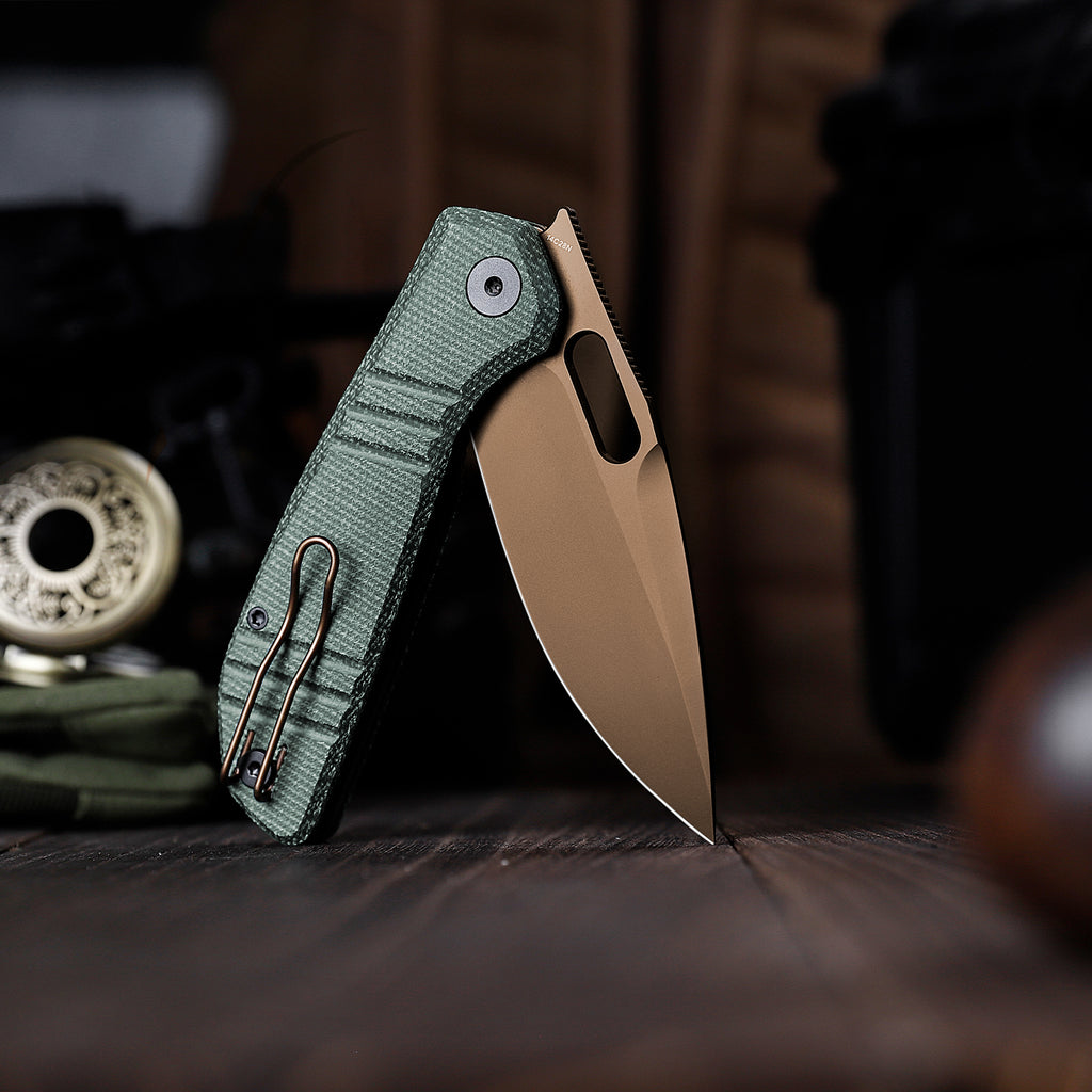 Close-up of TRIVISA Gecko-GM JM04-GM-14 folding knife with green Micarta handle and drop point blade