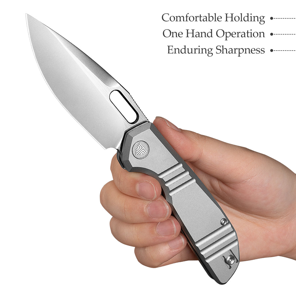 TRIVISA lockback knife with titanium handle, ceramic ball bearing, and pocket clip