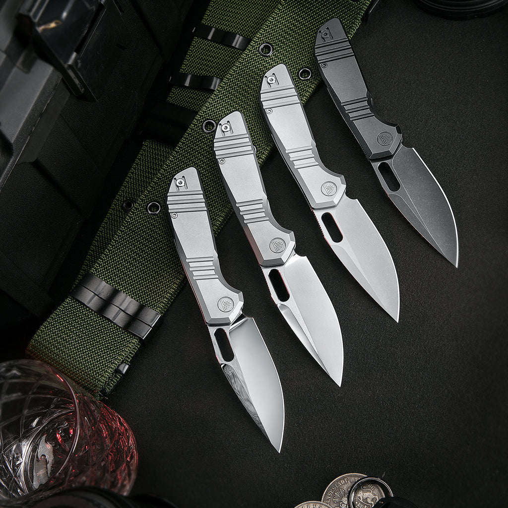 Set of four TRIVISA Gecko-P JM04-P-M knives with sleek titanium handles