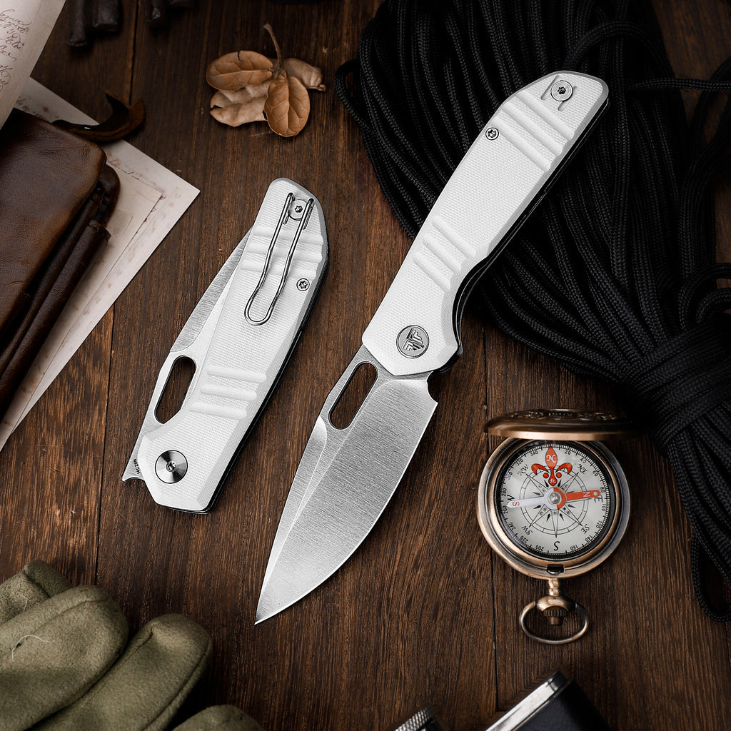 TRIVISA Gecko-WG JM04-WG-14 shown with the white G10 Gecko series folding knives