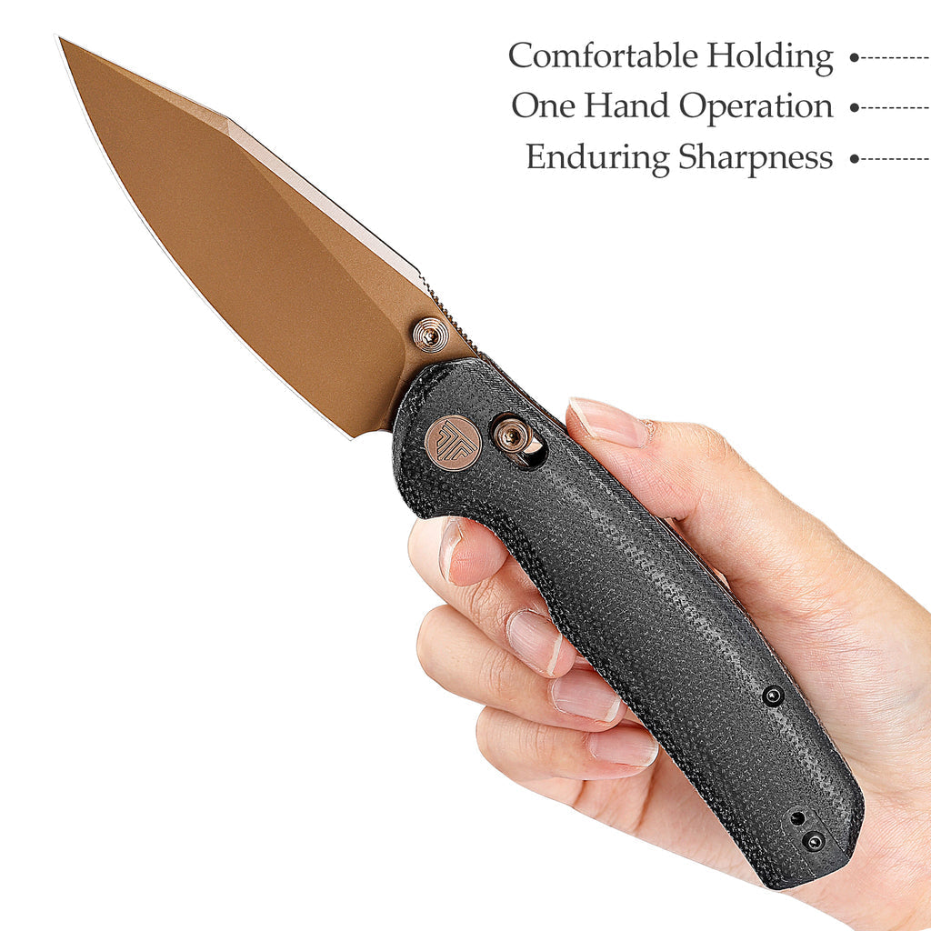 Hand holding bronze blade lock knife