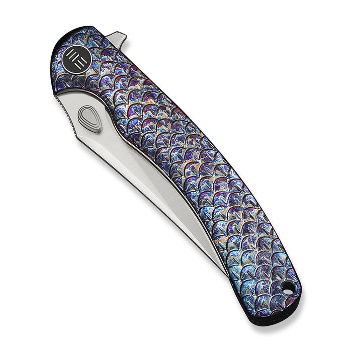 Colorful fish scale pattern on WE Knife Dracarys folding knife handle
