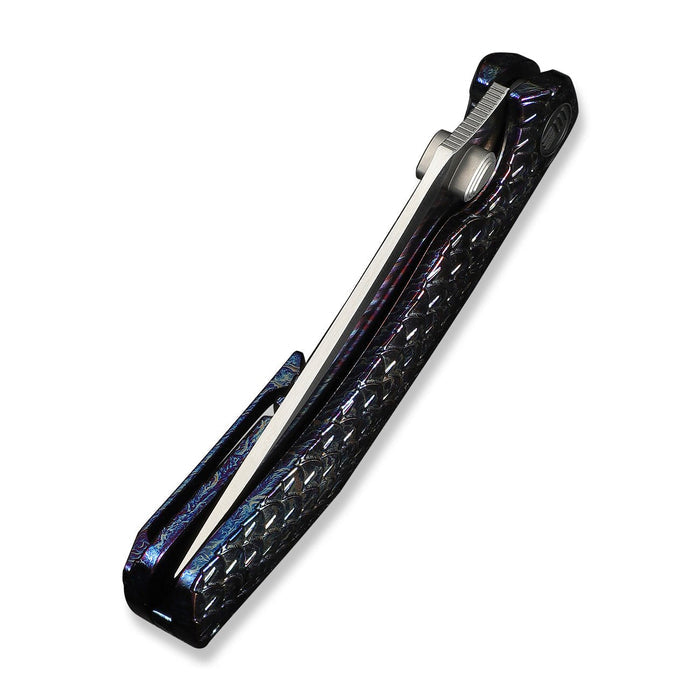 WE Knife Dracarys folding knife with fish scale patterned handle and blade