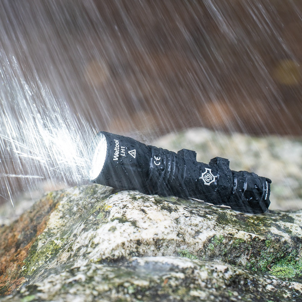 Weltool W35A Black (WEL-W35A-Black) weapon light under running water demonstrating its IP67 waterproof rating