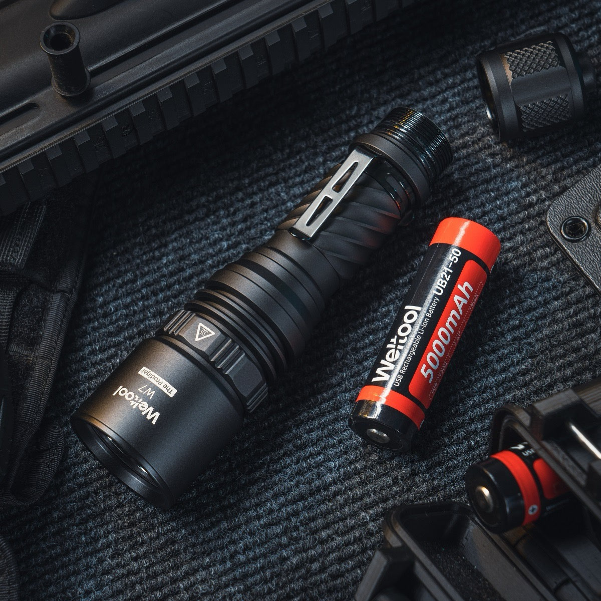 Tail button forward switch detail on the Weltool W7 LEP tactical flashlight