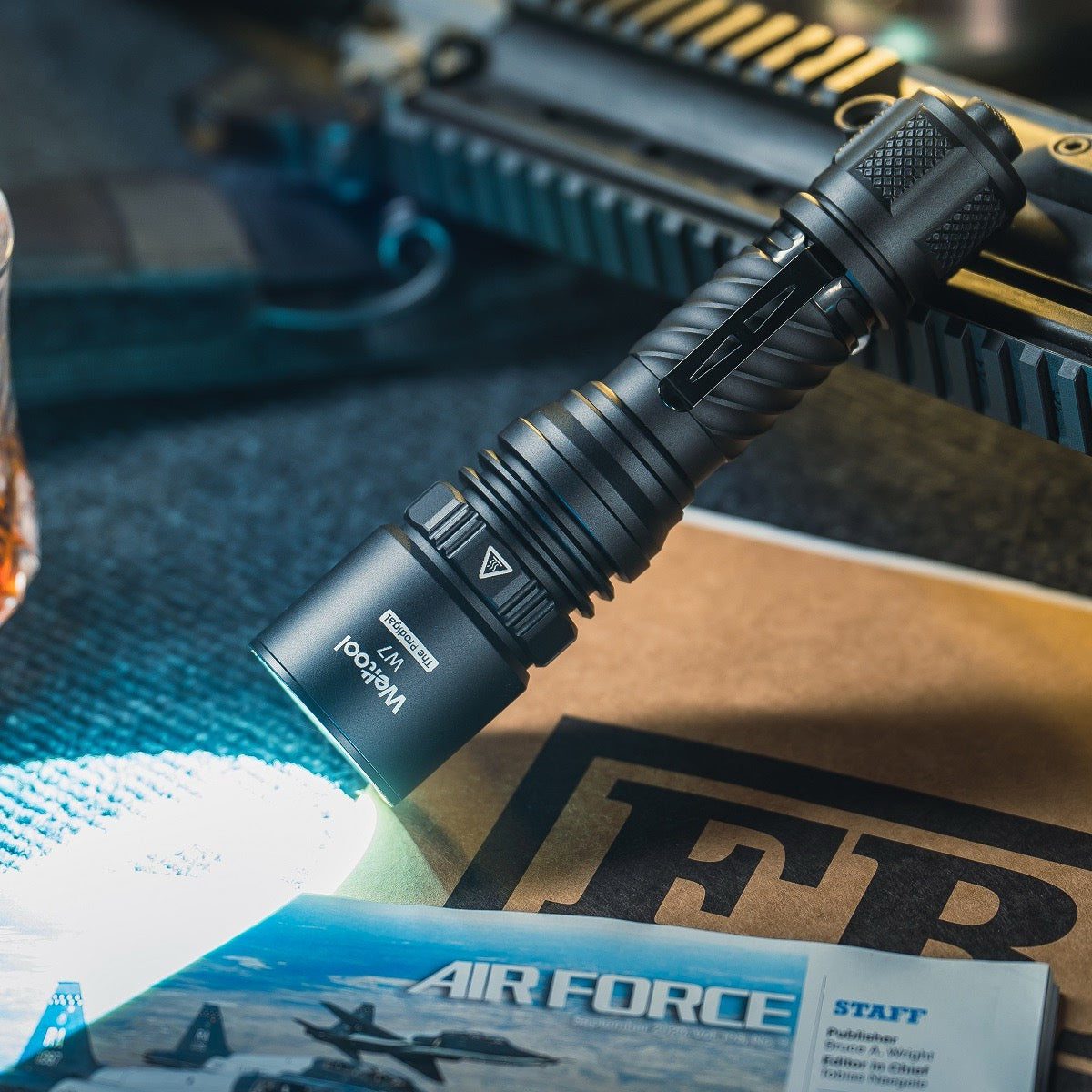 Weltool W7 LEP tactical flashlight full view showing CNC aluminum body and tail switch